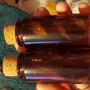 Set of 2 amber colored glass corked bottles